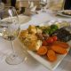 White wine in glass together with food on a restaurant in Stoby winery, Macedonia.